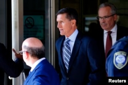 FILE - Former U.S. National Security Adviser Michael Flynn departs U.S. District Court, where he pleaded guilty to lying to the FBI about his contacts with Russia's ambassador to the United States, in Washington, Dec. 1, 2017.