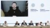 Presiden Ukraina Zelenskyy (tampak di monitor) ikut menghadiri secara virtual konferensi internasional untuk membantu rakyat Ukraina di Paris, Perancis Selasa (13/12). 