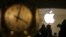 FILE - The Apple logo is pictured behind the clock at Grand Central Terminal in the Manhattan borough of New York, Feb. 21, 2016.