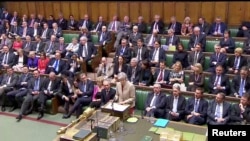 Britain's Prime Minister Theresa May speaks in the Parliament in London, Britain, March 29, 2019. 