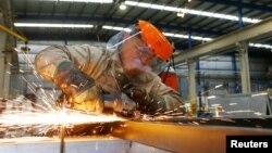 A laborer works at the Gottert machinery and tools plant factory in Garin, Argentina, May 20, 2016. 