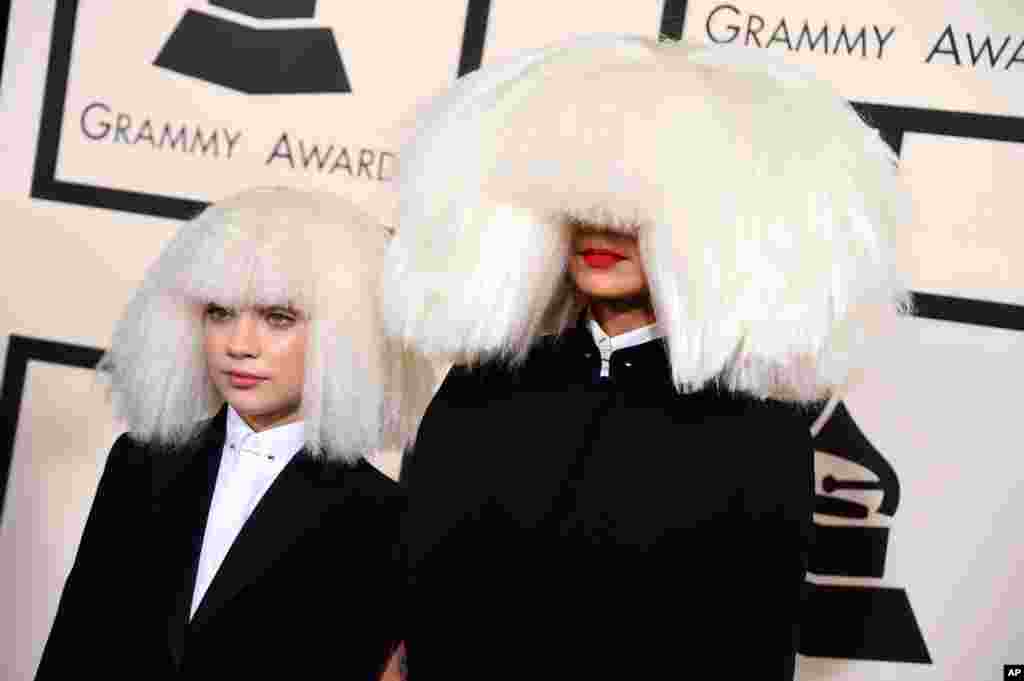 Sia, right, and Maddie Ziegler arrive at the 57th annual Grammy Awards at the Staples Center in Los Angeles, California, Feb. 8, 2015.