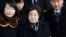FILE - Lee Hee-ho, center, the wife of the late former South Korean President Kim Dae-jung, arrives at the Inter-Korean Transit Office from North Korea at the border village of Paju in the demilitarized zone, South Korea, Dec. 27, 2011. 