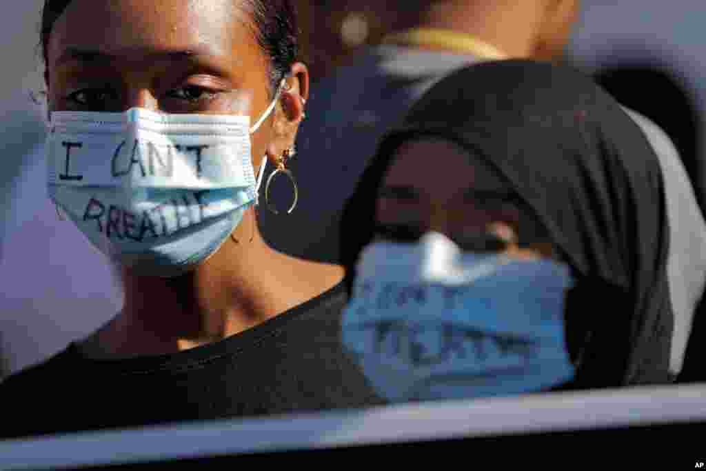 Demonstrators march, May 31, 2020, in Minneapolis.