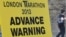 A road closure sign is seen placed along The Mall, the location for the London Marathon finish line, in central London, April 16, 2013.