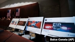 Facebook advertisements linked to a Russian effort to disrupt the American political process are shown at a Congressional hearing.
