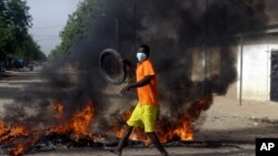 A boy protests on the street in N'Djamena, Chad, April 27, 2021.