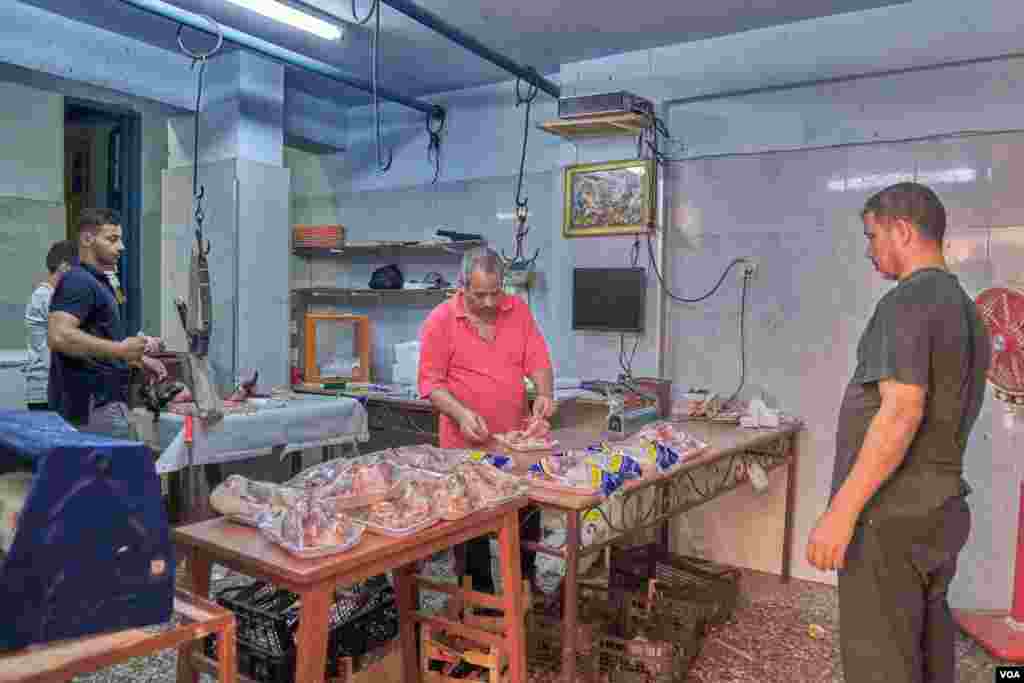 Virgin Mary devotees present animals for slaughtering and donate money in honor of the holy family. Sunday, August 18, 2019.