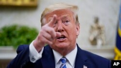 President Donald Trump speaks during a meeting with Gov. Ron DeSantis, R-Fla., in the Oval Office of the White House, April 28, 2020, in Washington. 