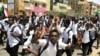 Sudanese students protest in the capital Khartoum, July 30, 2019, a day after teenagers were shot at a rally against shortages of bread and fuel in the town of al-Obeid, about 420 kilometers southwest of the capital.