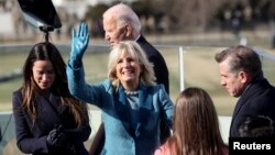Jill Biden waves after her husband, Joe, is sworn-in as the 46th U.S. president at the U.S. Capitol in Washington, January 20, 2021.