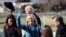 Jill Biden waves after her husband, Joe, is sworn-in as the 46th U.S. president at the U.S. Capitol in Washington, January 20, 2021.