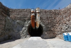 FILE - This photo shows the south portal of the proposed Yucca Mountain nuclear waste dump near Mercury, Nev., April 9, 2015.