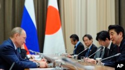 An undated photo provided by Russian Defense Ministry Press Service, shows soldiers and ballerinas posing for a photoshoot in Yekaterinburg to mark International Women&#39;s Day.