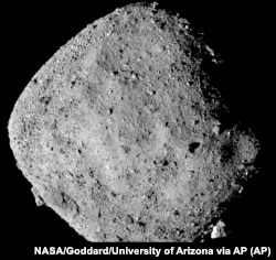 This mosaic image made from 12 PolyCam images collected on December 2, 2018, and provided by NASA shows the asteroid Bennu.