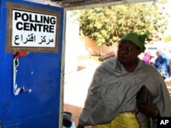 A South Sudanese woman arrives to vote at a polling centre in Khartoum January 9, 2011.