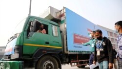 A pickup van carries Oxford-Astrazeneca COVID-19 vaccines, which arrived from India as a gift to Bangladesh, from the Hazrat Shahjalal International Airport to the storage house, in Dhaka, Bangladesh January 21, 2021.