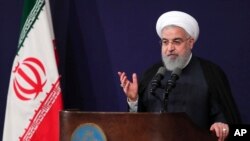 FILE - In this photo released by the official website of the office of the Iranian Presidency, President Hassan Rouhani speaks in Tehran, Aug. 6, 2018. Rouhani said Monday no effort should be spared to help victims of an earthquake that hit Nov. 25, 2018.