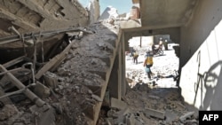 This picture shows the destruction caused by reported govenrment forces' bombings in the town of Al Habit on the southern edges of rebel-held Idlib province, Sept. 10, 2018. 