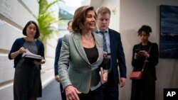 Speaker of the House Nancy Pelosi, D-Calif., returns to her office after meeting with fellow Democrats, on Capitol Hill in Washington, Tuesday, March 10, 2020.