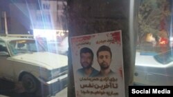 Traktor azarkeşləri saxlanılan fəallara dəstək üçün şəhərdə posterlər yerləşdiriblər.