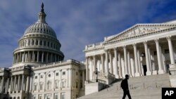 A man walks past the the U.S. Capitol, in Washington, Oct. 27, 2021.