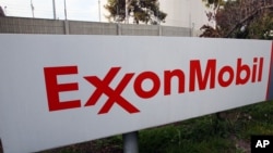 FILE - A sign for the ExxonMobil Torerance Refinery in Torrance, California, Jan. 30, 2012