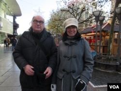 Ulrich Mueller, left, believes Schengen should continue, but controls on the EU border should be increased. (A. Tanzeem/VOA)