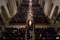 FILE - The procession for the funeral mass for the late Supreme Court Associate Justice Antonin Scalia at the Basilica of the National Shrine of the Immaculate Conception in Washington, Feb. 20, 2016.