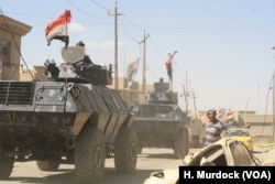 Iraqi forces move towards the battle in Mosul, June 4, just hours before IS threw a homemade chemical weapon at 73rd Brigade Army soldiers on the frontlines.