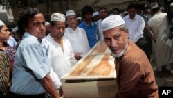 FILE - Bangladeshi Muslims carry the body of Xulhaz Mannan for his funeral in Dhaka, Bangladesh, April 26, 2016. 