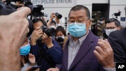 Jimmy Lai, founder of Hong Kong's Apple Daily newspaper, walks out from a police station after being bailed out in Hong Kong, Feb. 28, 2020.