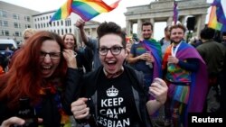 People celebrate Germany's parliament legalizing same-sex marriage in front of the Brandenburg Gate in Berlin, Germany June 30, 2017.