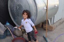 When IS took child slaves, they re-named them. This girl, pictured in Khanke, Kurdistan region, Iraq, on Sept. 28, 2019, was born in captivity. Her mother later gave her the name Mukhaban, which means "sorrow." (Heather Murdock/VOA)