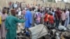 People look at the damages after two explosions rocked in a crowded neighbourhood of Nigeria&#39;s restless northeastern city of Maiduguri, a stronghold of Boko Haram Islamists, March 2, 2014.