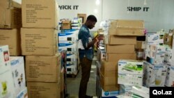 A staff member takes stock of goods at the warehouse of Konga online shopping company in Ilupeju district in Nigeria's commercial capital Lagos, Sept. 13, 2013. 