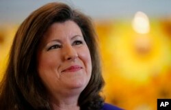 FILE - Republican Karen Handel speaks to a reporter in Roswell, Georgia, May 14, 2014.