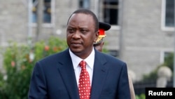 Kenya's President Uhuru Kenyatta prepares to inspect a guard of honor in Nairobi, April 16, 2013.