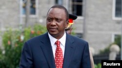 FILE - Kenya's President Uhuru Kenyatta at the National Assembly Chamber in Nairobi, April 16, 2013.