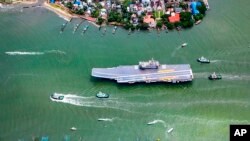 In this handout picture provided by the Indian Navy, INS Vikrant sails for sea trials from Kochi, India, Aug. 25, 2022.