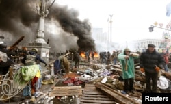 FILE - Anti-government protesters gather in Independence Square in central Kyiv, Feb. 19, 2014.
