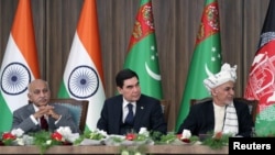 Afghanistan President Ashraf Ghani, right, Turkmenistan President Kurbanguly Berdymukhamedov, center, and India's Minister of State for External Affairs M.J. Akbar attend the inauguration ceremony of TAPI pipeline construction work, in Herat, Afghanistan.