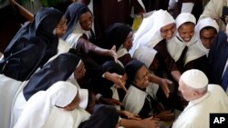 Pope Francis is greeted by nuns during his visit at the Discalced Carmelite Nuns monastery in Antananarivo, Madagascar, Sept. 7, 2019. Francis is in Madagascar for the second leg of his weeklong trip to Africa.