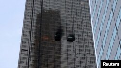 A residential unit's exterior is pictured following a fire at Trump Tower in the Manhattan borough of New York City, April 7, 2018. 
