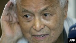 FILE - Li Rui, a former secretary to Chairman Mao Zedong, listens to a question during an interview in Beijing in 2006. 