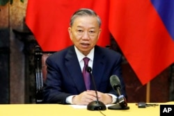 FILE - Vietnamese President To Lam speaks during a press briefing with Russian President Vladimir Putin, unseen, at the Presidential Palace in Hanoi, Vietnam, on June 20, 2024.