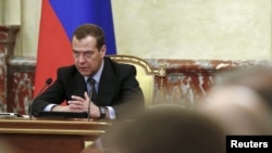 FILE - Russian Prime Minister Dmitry Medvedev chairs a meeting with members of the government in Moscow, Russia, June 29, 2017. On Thursday, Medvedev announced sanctions against Ukrainian individuals and entities "to counter Ukraine's unfriendly activities."