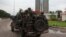 Congolese soldiers in their truck toward the state television headquarters in the capital Kinshasa, Democratic Republic of Congo, Dec. 30, 2013.