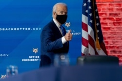 FILE - President-elect Joe Biden departs a news conference after introducing his nominees and appointees to economic policy posts at The Queen theater, Dec. 1, 2020, in Wilmington, Del.