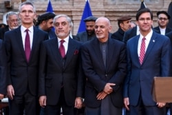 NATO Secretary General Jens Stoltenberg, Afghan opposition presidential candidate Abdullah Abdullah, Afghan President Ashraf Ghani, and U.S. Secretary of Defense Mark Esper pose for a photo at the presidential palace in Kabul, Feb. 29, 2020.